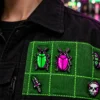 Glitch Beetle Pin Pair worn or in use